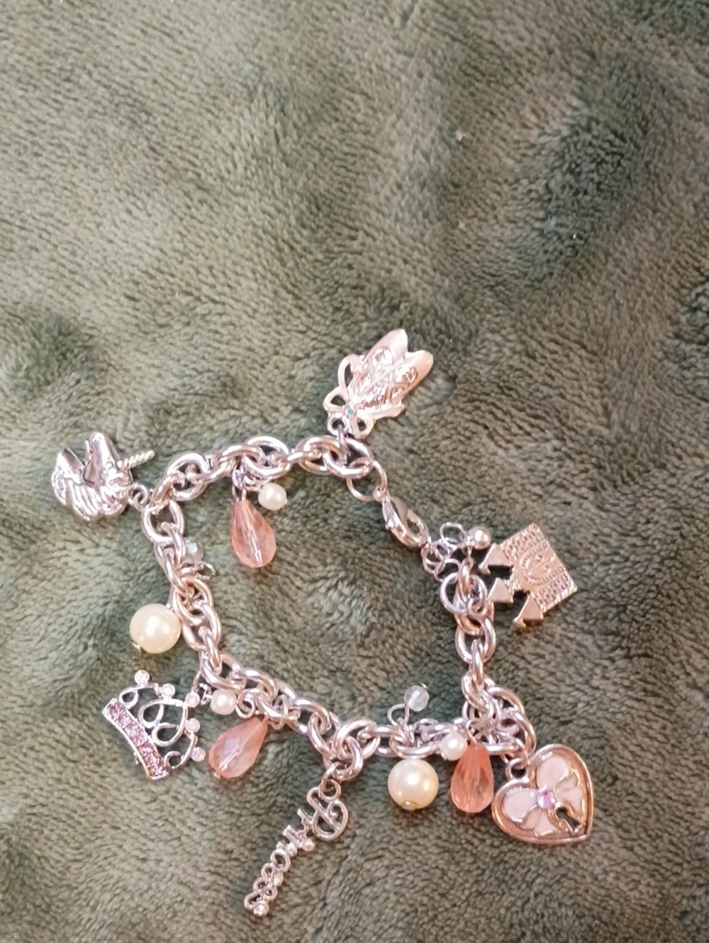 Silver-Tone Pink Charm Bracelet Features A Dangling Princess Scrip Charm